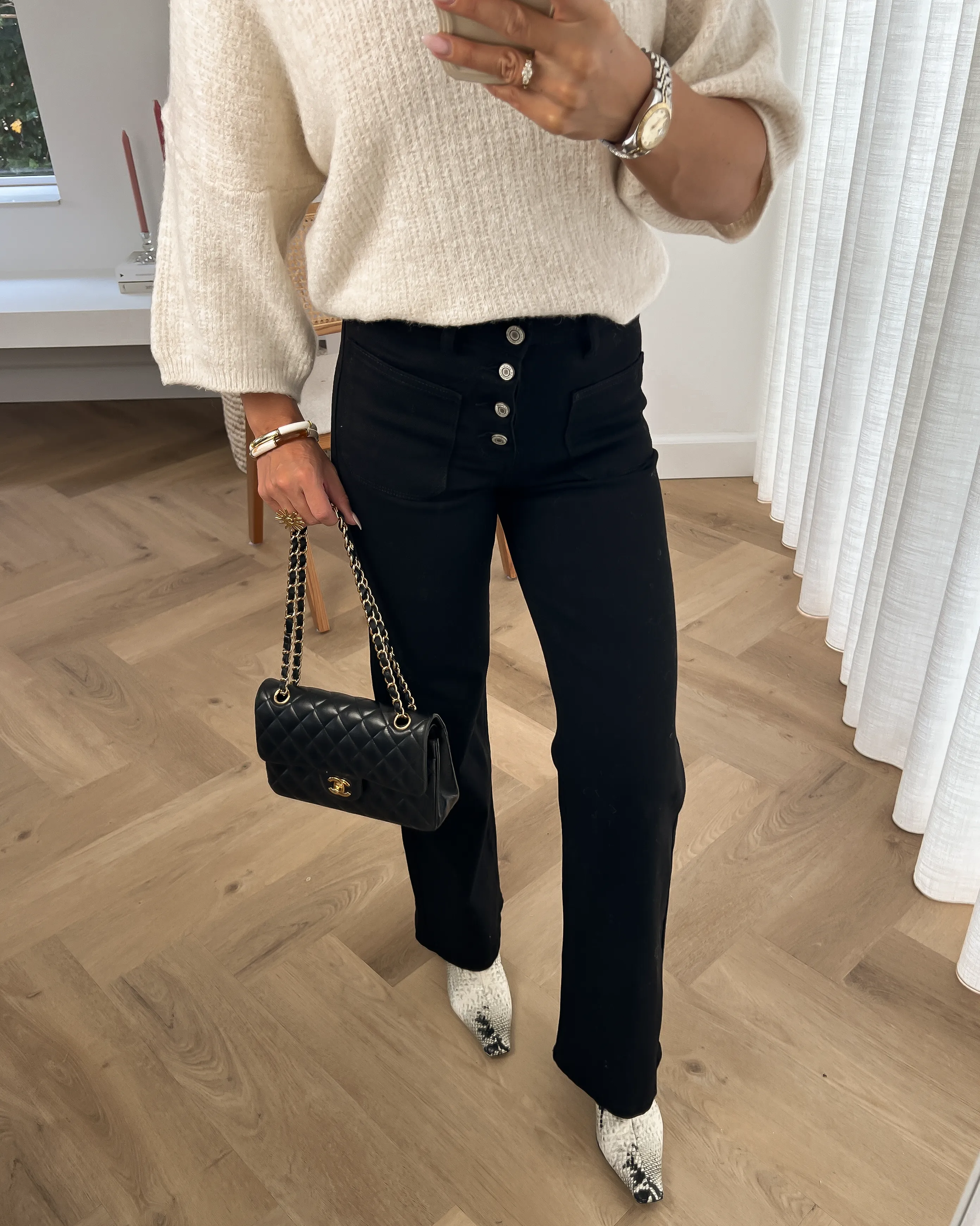 Black Button Flare Jeans by Valerie
